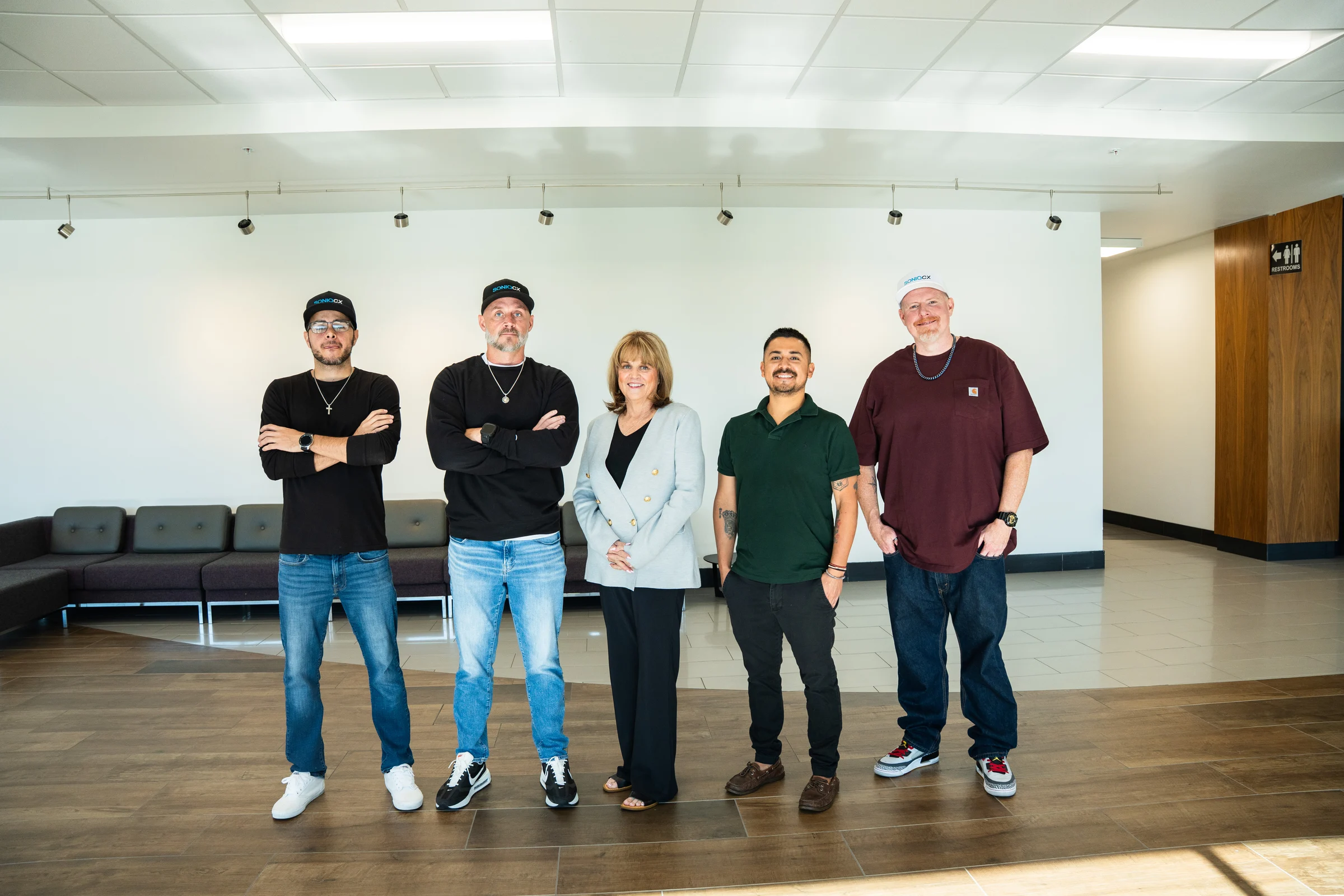 The SONIQCX team together at the office